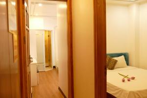 Voodi või voodid majutusasutuse Maison d'Hanoi Hotel toas