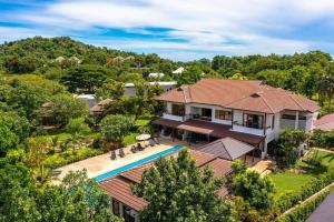 an aerial view of a house with a swimming pool at Large 6 Bed Luxury Villa on the Golf Course PHJ in Cha Am