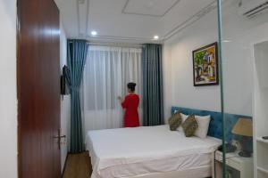 Voodi või voodid majutusasutuse Maison d'Hanoi Hotel toas