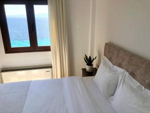 A bed or beds in a room at Aegean Blue Horizon