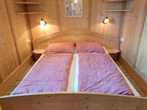a bed in a sauna with two beds at Chalet Faschingalm in Debant