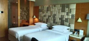 Postel nebo postele na pokoji v ubytování Courtyard by Marriott Madurai