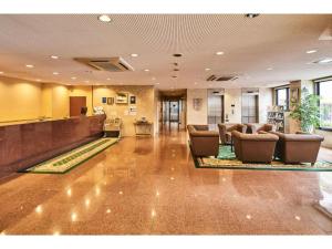 a lobby with chairs and a bar in a hotel at Urayasu Sun Hotel - Vacation STAY 33022v in Urayasu