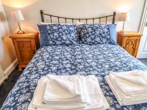 Postelja oz. postelje v sobi nastanitve Lilac Cottage