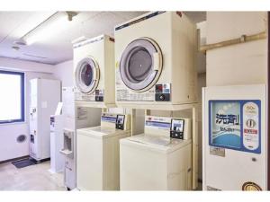 a room with several washing machines and appliances at Urayasu Sun Hotel - Vacation STAY 33015v in Urayasu