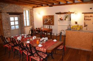 a dining room with a table and chairs at Angolo Del Poeta in Bergamo