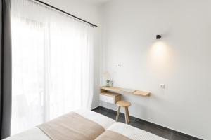 Postel nebo postele na pokoji v ubytování Yuka Villas Collection
