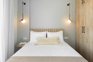 Postel nebo postele na pokoji v ubytování Yuka Villas Collection