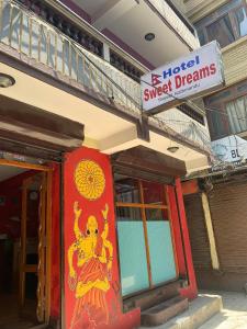 a building with a painting on the side of it at Hotel Sweet Dreams thamel kathmandu in Kathmandu