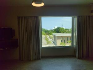 a large window with a view of a building at Courtyard by Marriott Madurai in Madurai