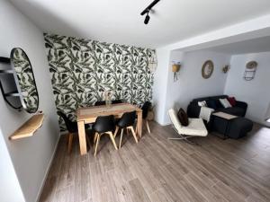 a living room with a table and a couch at La Casa de la Abuela in Mijas