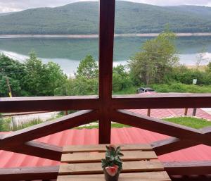 a view of a lake from a window at Vila Jana Mavrovo in Mavrovo