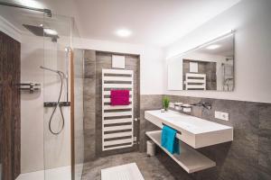 Kúpeľňa v ubytovaní Alpenherz Apartments