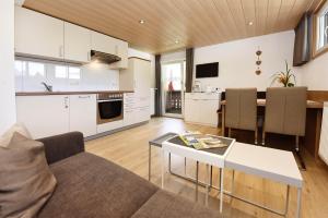 Kuchyňa alebo kuchynka v ubytovaní Alpenherz Apartments