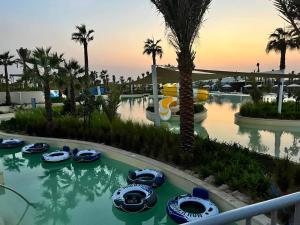 a group of boats in a pool at a resort at brand new villa in Dubai