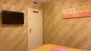 Telewizja i/lub zestaw kina domowego w obiekcie Apartamento Golf Beach