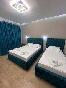 Postel nebo postele na pokoji v ubytování Guesthouse Dauti