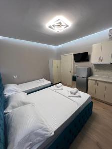 Postel nebo postele na pokoji v ubytování Guesthouse Dauti