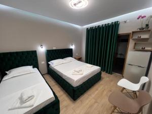 Postel nebo postele na pokoji v ubytování Guesthouse Dauti
