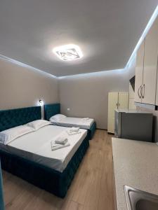 Postel nebo postele na pokoji v ubytování Guesthouse Dauti