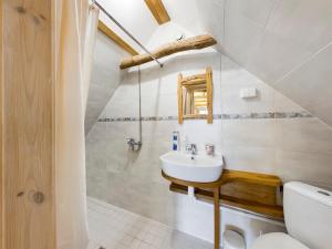 a bathroom with a sink and a toilet at Pädaste Välja Apartments in Pädaste