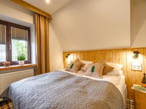 Posteľ alebo postele v izbe v ubytovaní VisitZakopane - Willa Bajka Apartments