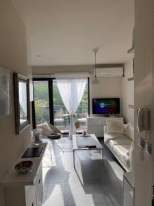 A television and/or entertainment centre at Luxury Central Apartment