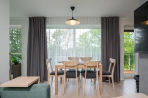 a dining room with a table and chairs at Kalda Villa 