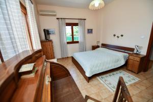 Postel nebo postele na pokoji v ubytování Villa Koliri