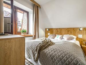 Posteľ alebo postele v izbe v ubytovaní VisitZakopane - Willa Bajka Apartments