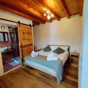 a bedroom with a bed with towels on it at Corte Lusenzo in Chioggia