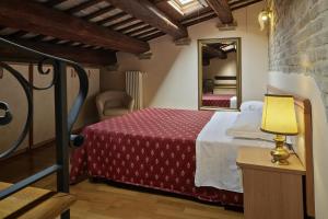 Posteľ alebo postele v izbe v ubytovaní Residence Cavour 63