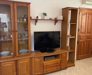Televízia a/alebo spoločenská miestnosť v ubytovaní MojacarProperty, Apto El Palmeral
