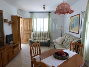Televízia a/alebo spoločenská miestnosť v ubytovaní MojacarProperty, Apto El Palmeral