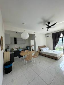 a living room with a couch and a table at New Cozy The Sun Homestay at Sg Nibong Bayan Lepas Factory Area in Bayan Lepas