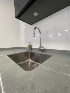 Η κουζίνα ή μικρή κουζίνα στο Seaside Apartment Retreat