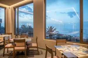 Reštaurácia alebo iné gastronomické zariadenie v ubytovaní KING MINOS RETREAT Resort & Spa