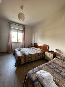 Postel nebo postele na pokoji v ubytování hotel La pineta