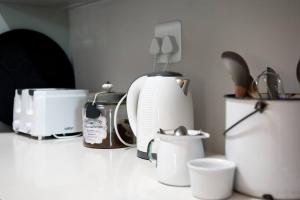 a kitchen counter with a toaster and other appliances at Cottage Twelve14 in Wilderness