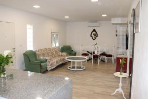a living room with a couch and a table at Vixía do Val, "Eclectic" in Mos