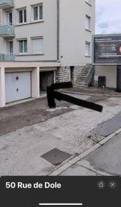 a pipe is laying on the side of a building at LE 46 : Superbe appartement jacuzzi in Besançon