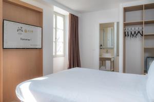 Postel nebo postele na pokoji v ubytování La Clef des Châteaux