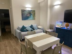 a living room with a couch and a table at A 34 passi dal mare in Torre Ovo