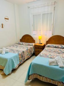 Postel nebo postele na pokoji v ubytování Apartamento Bella Bahía