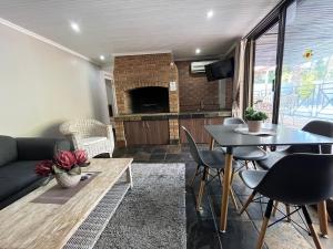 a living room with a couch and a table at Panorama Self Catering in Panorama