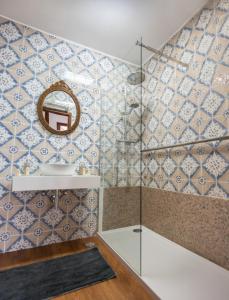 a bathroom with a sink and a mirror at Apartamento T3 - D'ouro a Vista in Peso da Régua