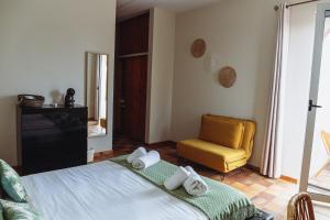 Tempat tidur dalam kamar di Porto Santo Destination
