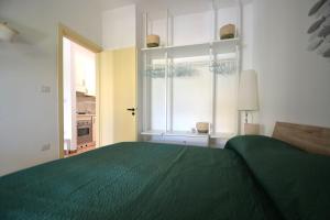 En eller flere senge i et værelse på Villetta Gianira per 5 ospiti-pt58