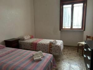 Postel nebo postele na pokoji v ubytování 15 minuti dal mare