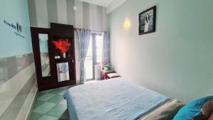 Postel nebo postele na pokoji v ubytování DaLat Sky Hostel